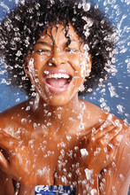 Cute African American Splashes Water To Clean Her Face