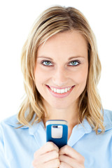 Poster - Happy young woman writing a message on her cellphone