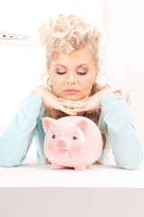 Canvas Print - lovely woman with piggy bank