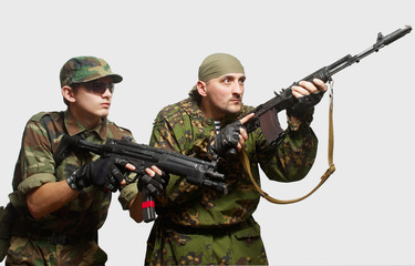 Portrait of soldiers with an automatic assault rifles