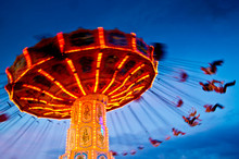 Action Photo Of Carousel At Sunset