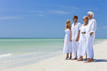 Wall Mural - Two Couples Generations Family Holding Hands on Tropical Beach