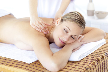 Positive woman having a back massage