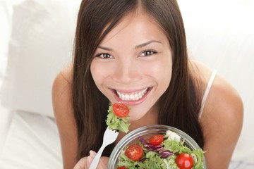 Wall Mural - Woman eating salad