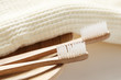 Closeup of wooden toothbrush with towel
