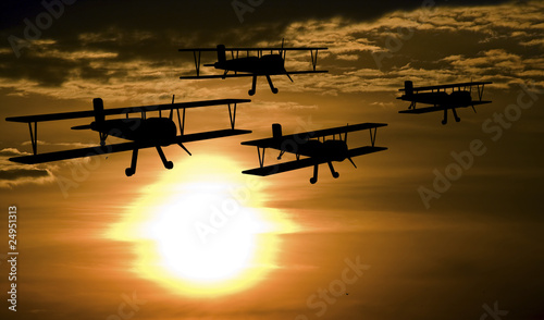 Cuadros en Lienzo Patrolling airplanes at the sunset
