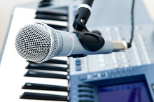 Microphone And Piano Keyboard Close-up