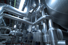 Pipes, Tubes, Machinery And Steam Turbine At A Power Plant