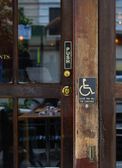 The disabled access sign from the entrance of a restaurant