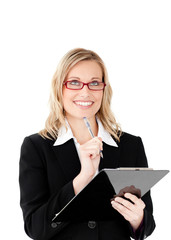 Poster - Thoughtful businesswoman holding a clipboard