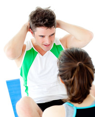 Sticker - Handsome man doing fitness exercises with a woman