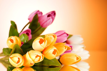 Wall Mural - Bouquet of colorful tulips on the table