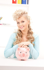 Wall Mural - lovely woman with piggy bank