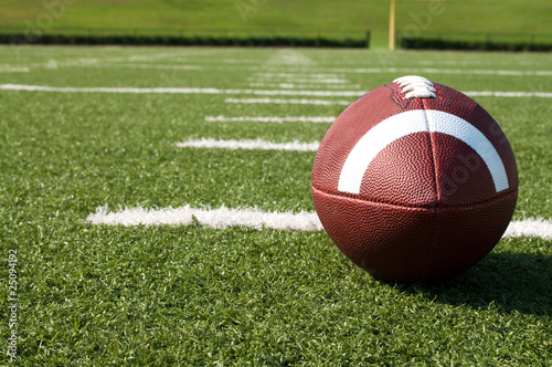Closeup of American Football on Field - Buy this stock photo and
