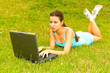 girl with notebook on the grass