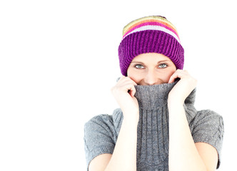 Poster - Young woman wearing a colorful hat and a grey pullover