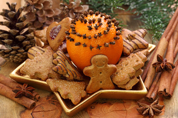 Poster - Christmas cakes and oranges on brown background