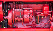 Red Engine On Old Tractor