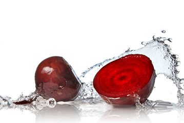 Wall Mural - red beet with water splash isolated on white