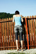 Woman looking over the fence