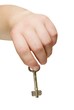 metal key in the hand isolated with path.