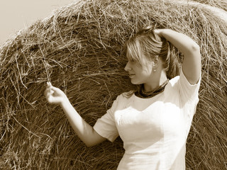 Country view. pretty adult woman portrait on the field