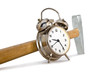 Alarm clock and hammer on a white background