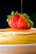 Strawberry butter pancake with honey/ maple sirup flowing down