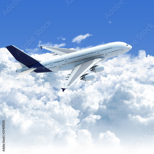 Fototapeta dla dzieci airplane flying over the clouds side top view
