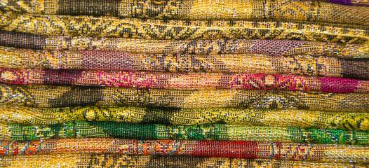 A cikkection f colorful fabric of different patterns and sizes