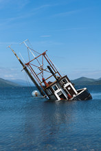 Partially Submerged Fishing Vessel In Loch Linnie