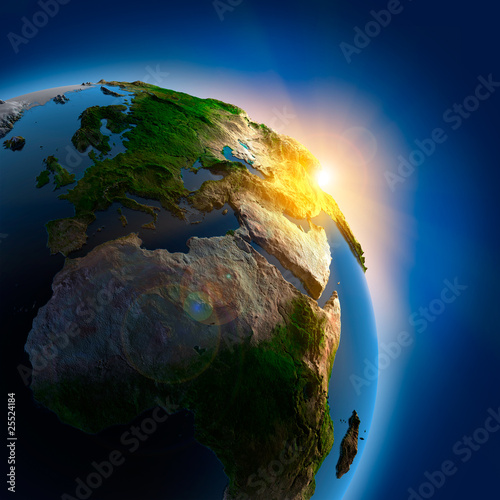 Fototapeta na wymiar Sunrise over the Earth in outer space