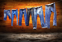 Jeans On A Clothesline To Dry On The Grunge Background