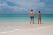 © Iosif Yurlov - Young couple standing on a sandy tropical beach