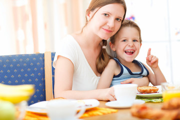 Canvas Print - Mother and son having breakfast