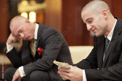 Fotografia, Obraz Successful businessman counting his money