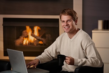 Wall Mural - Young man working at home