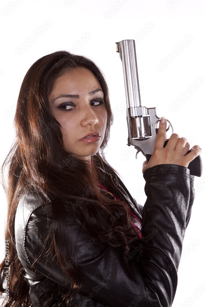 Woman holding gun looking back Stock Photo | Adobe Stock