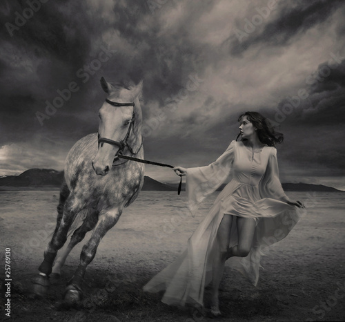 Naklejka na szybę Fine art photo of a young beauty running with a horse