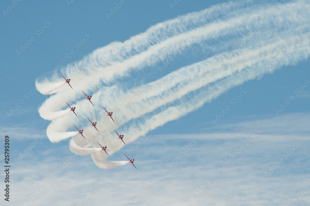 formation aerobatics team leaving smoke trails in the sky - obrazy, fototapety, plakaty 