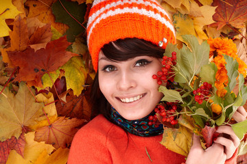 Wall Mural - girl in autumn orange leaves.