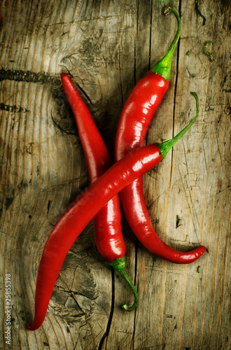 Fotografie, Obraz Red Hot Chili Peppers over wooden background