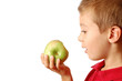 Child eats an green apple