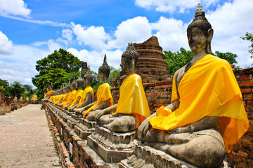 Wall Mural - Stone statue of a Buddha in Ayutthaya, Thailand.