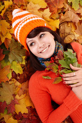Wall Mural - girl in autumn orange leaves.