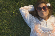 High Angle View Of Woman Sleeping In Grass