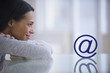 © JGI/Tom Grill/Blend Images - Mixed race woman staring at email symbol