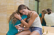 © Kikor/Blend Images - Hispanic teenager crying and holding pregnancy test in bathroom