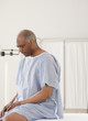 © JGI/Jamie Grill/Blend Images - African man waiting for doctor in hospital