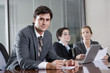 © Kablonk Micro - Businessman in boardroom with female colleagues
